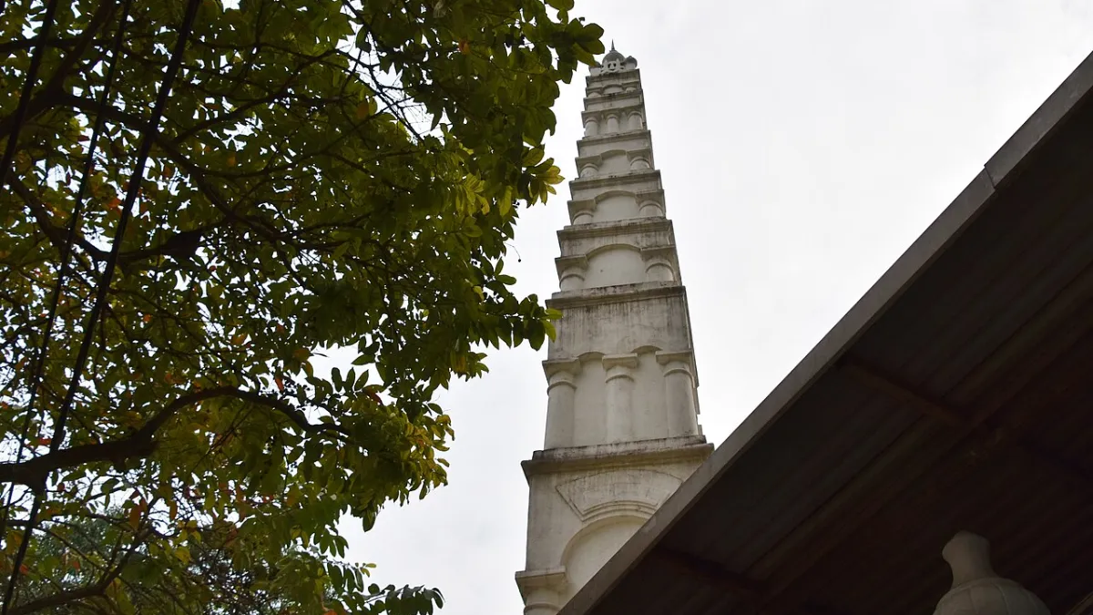Slender white minaret of Al-Noor Mosque rising above the Old Quarter, Hanoi