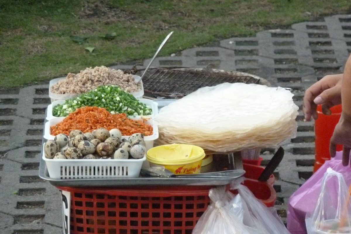 Street stall in Ho Chi Minh City with ingredients for banh trang nuong grilled rice paper