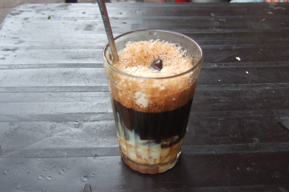 Glass of ca phe sua da, Vietnamese iced coffee with condensed milk