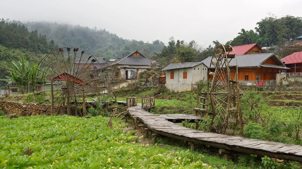 Traditional water wheel and wooden houses in Cat Cat Village, Sapa