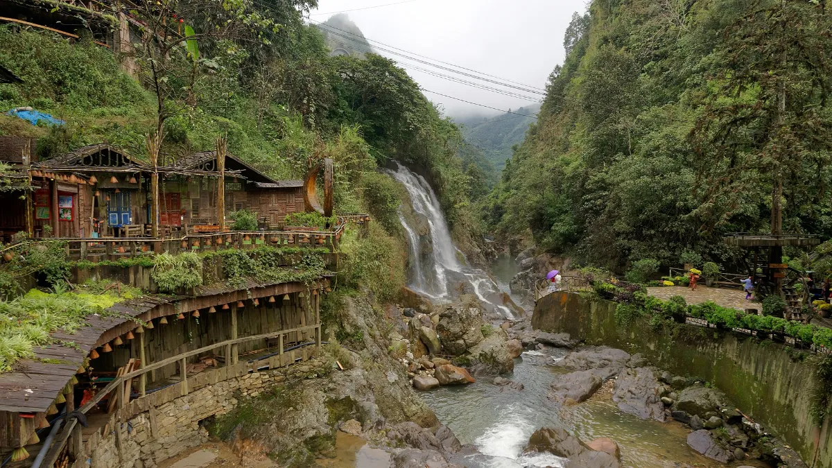 Cat Cat waterfall and wooden bridge in Cat Cat Village, Sapa