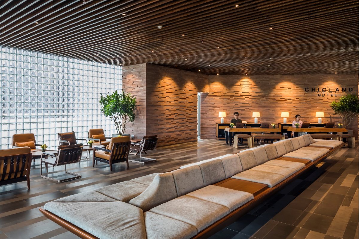 Lobby with wooden lattice walls at Chicland Danang Beach Hotel