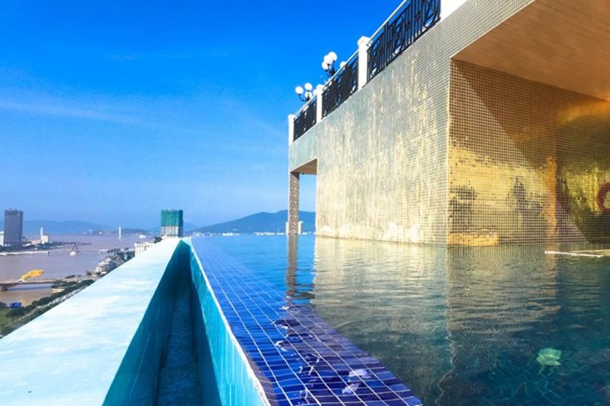 Rooftop pool with a view of the Han River at Fivitel Da Nang