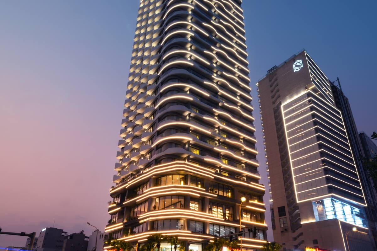 Hilton Garden Inn Da Nang tower on Vo Nguyen Giap beach road at sunset