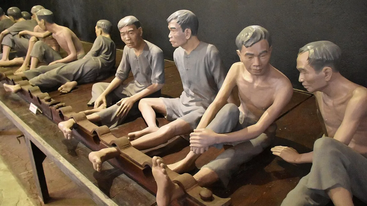 Exhibit of shackled prisoners inside Hoa Lo Prison, Hanoi
