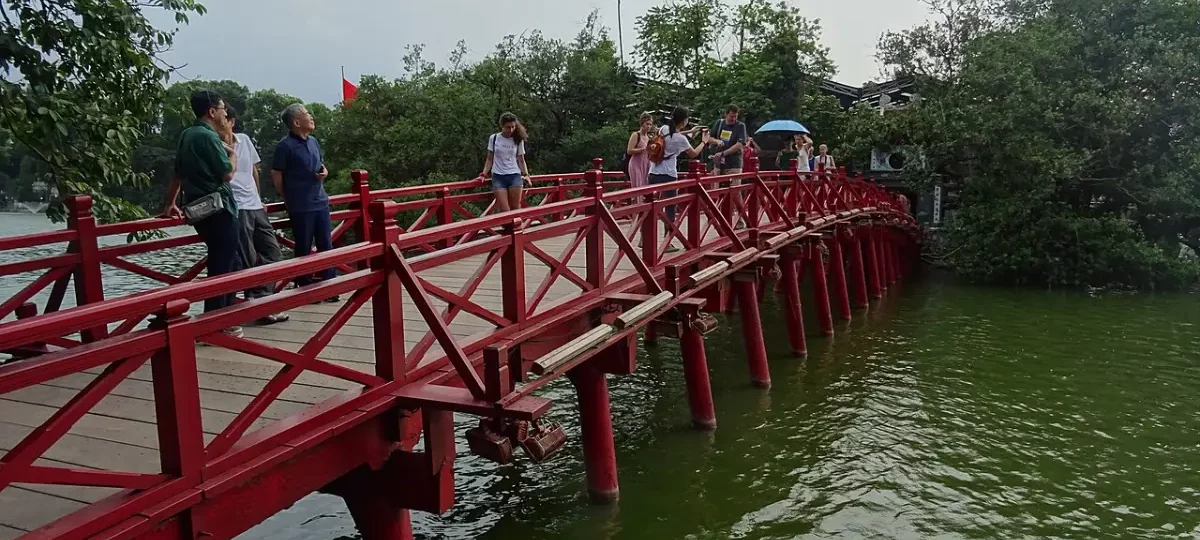 Red The Huc Bridge leading to Ngoc Son Temple on Hoan Kiem Lake, Hanoi