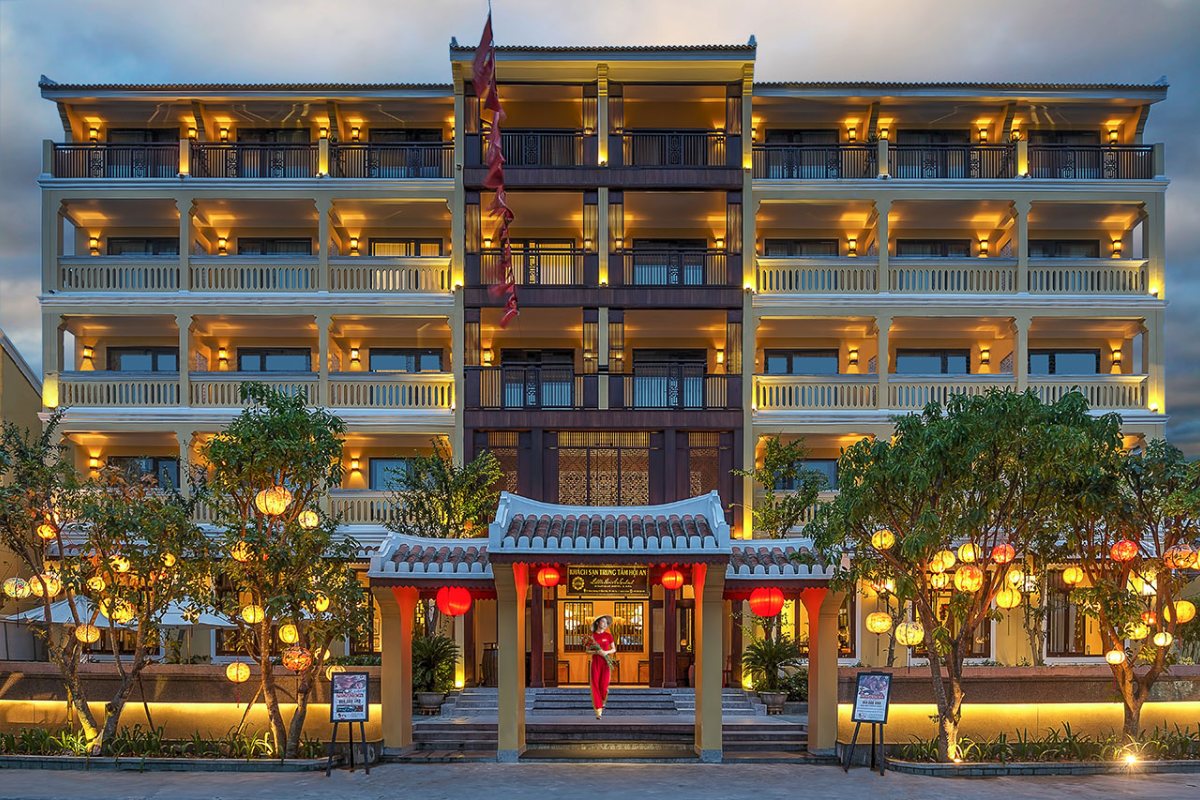 Hoi An Central Boutique Hotel facade lit up in the evening