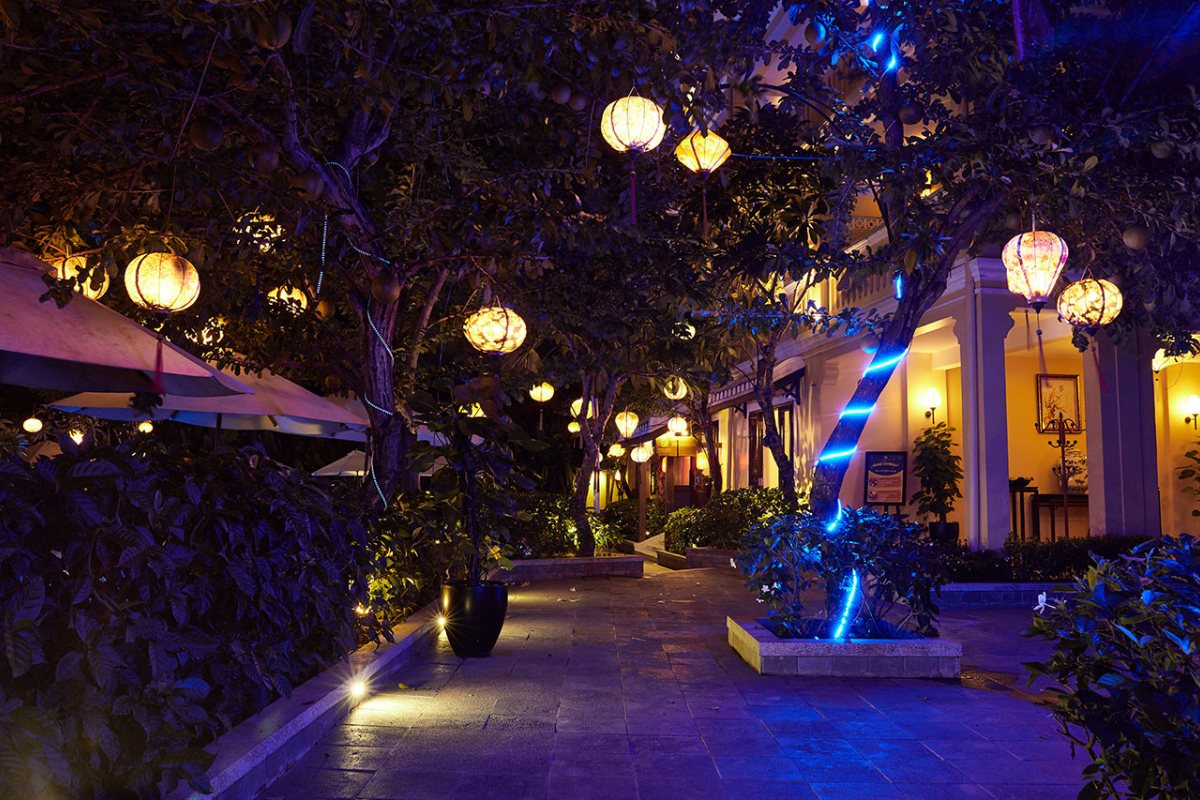 Garden with lanterns at night at Hoi An Central Boutique Hotel