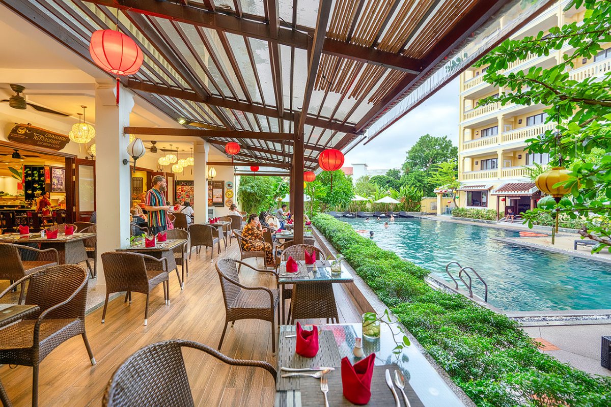 Poolside dining area at Hoi An Central Boutique Hotel