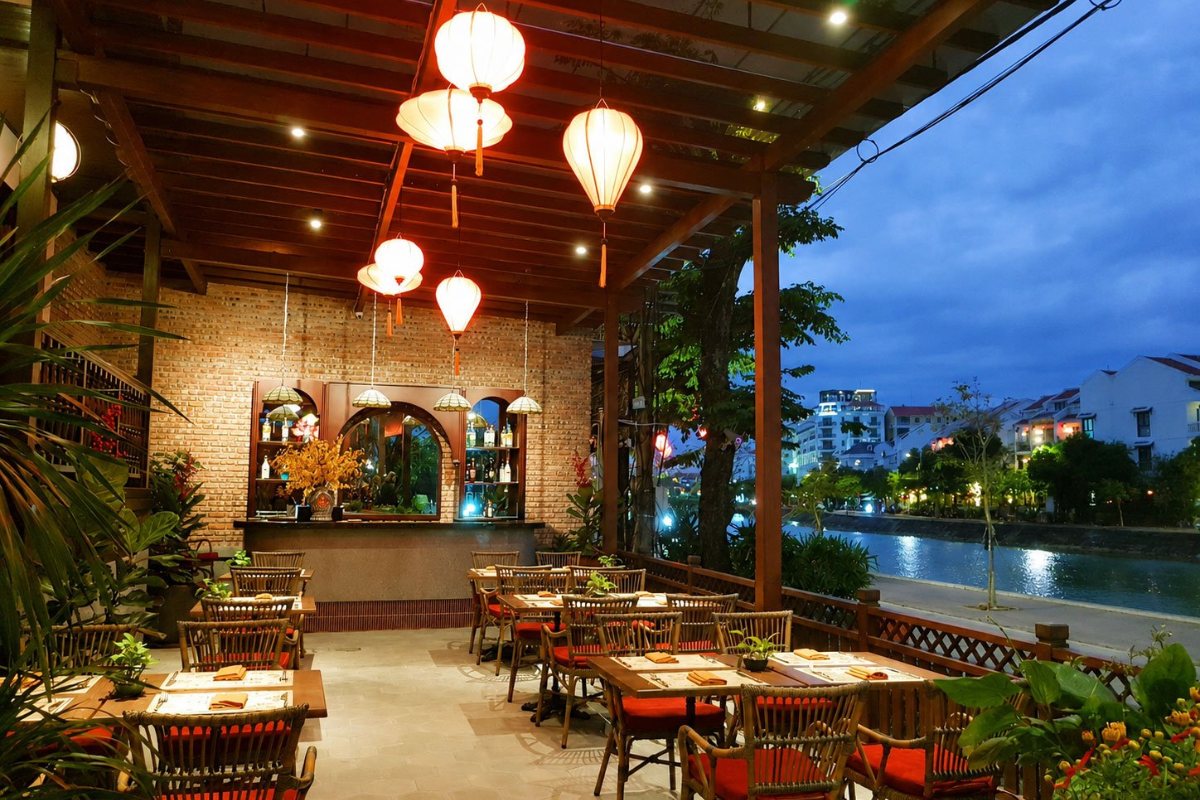 Long Den Restaurant terrace by the river at Little Hoi An