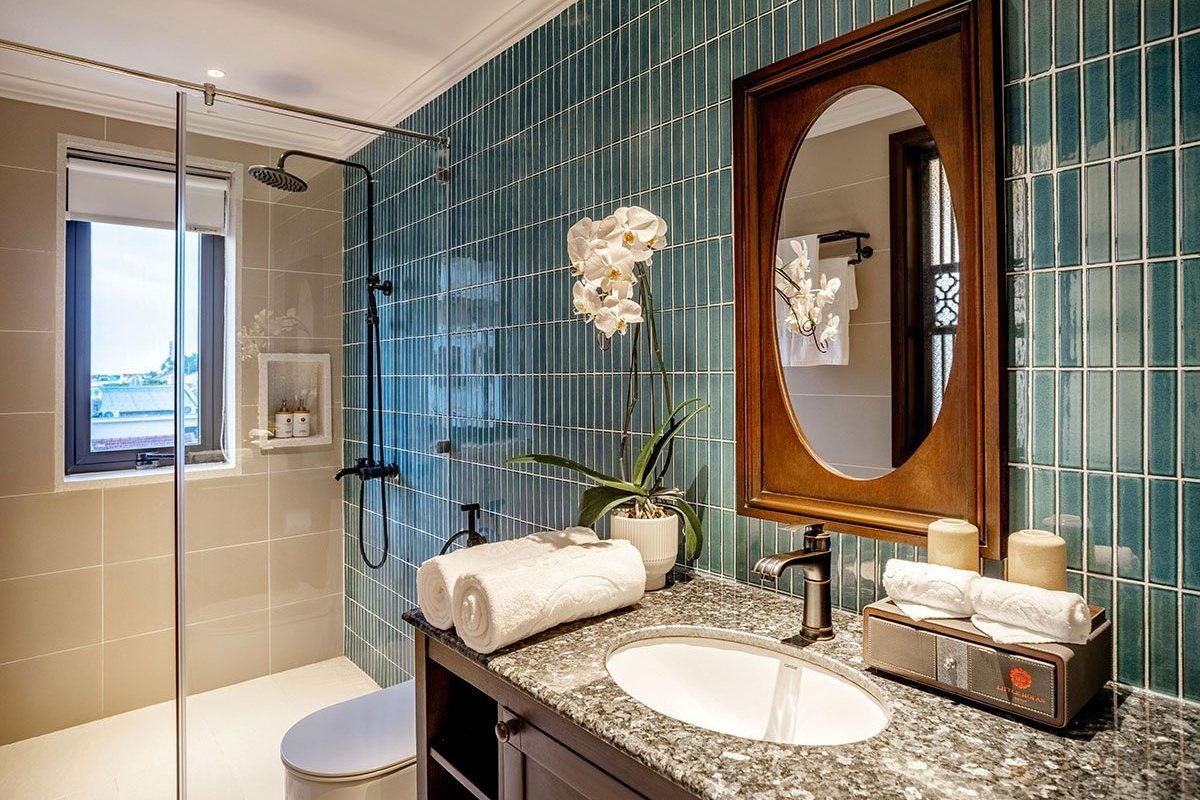 Bathroom with green tiles at Little Residence Hoi An