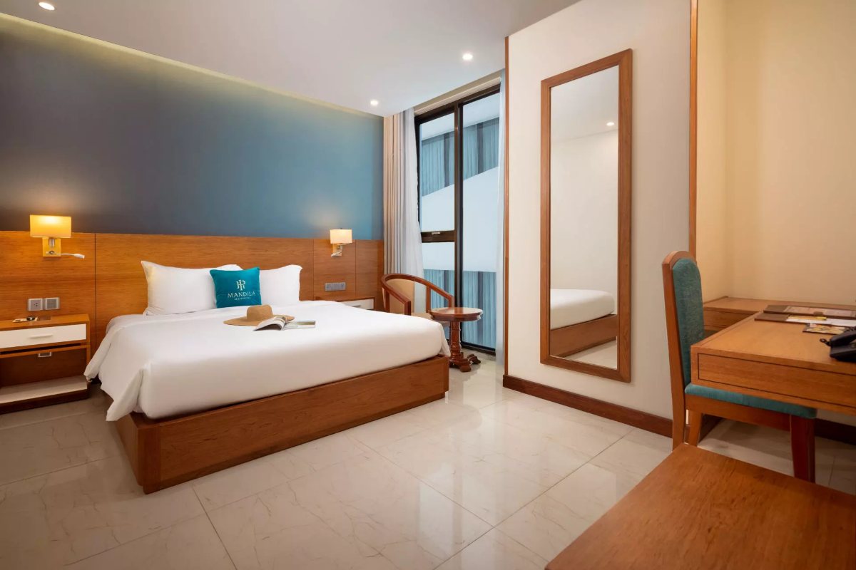 Deluxe King room with a window at Mandila Beach Hotel
