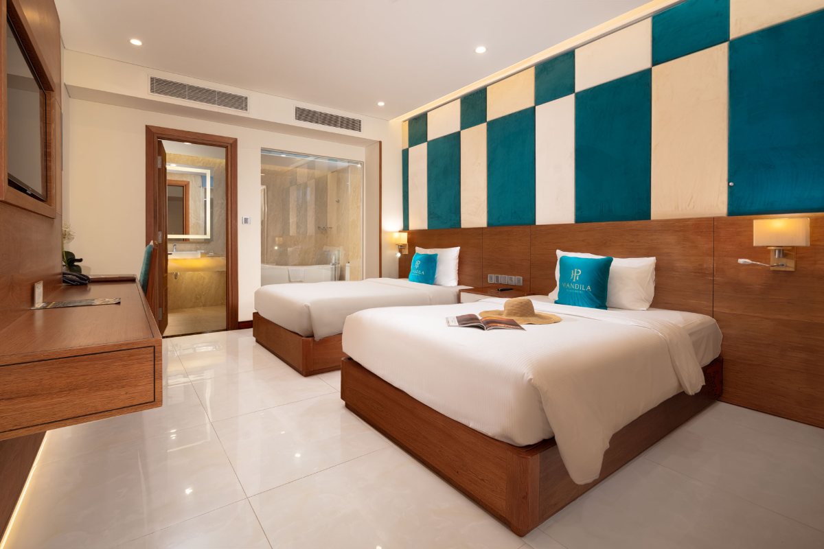 Two beds in the Deluxe Twin room at Mandila Beach Hotel