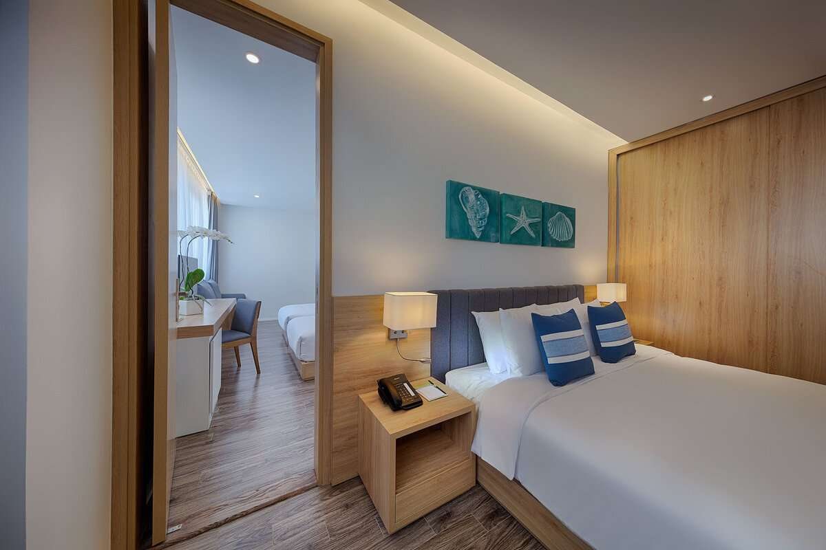 Bed in the Deluxe room at Parosand Danang Hotel