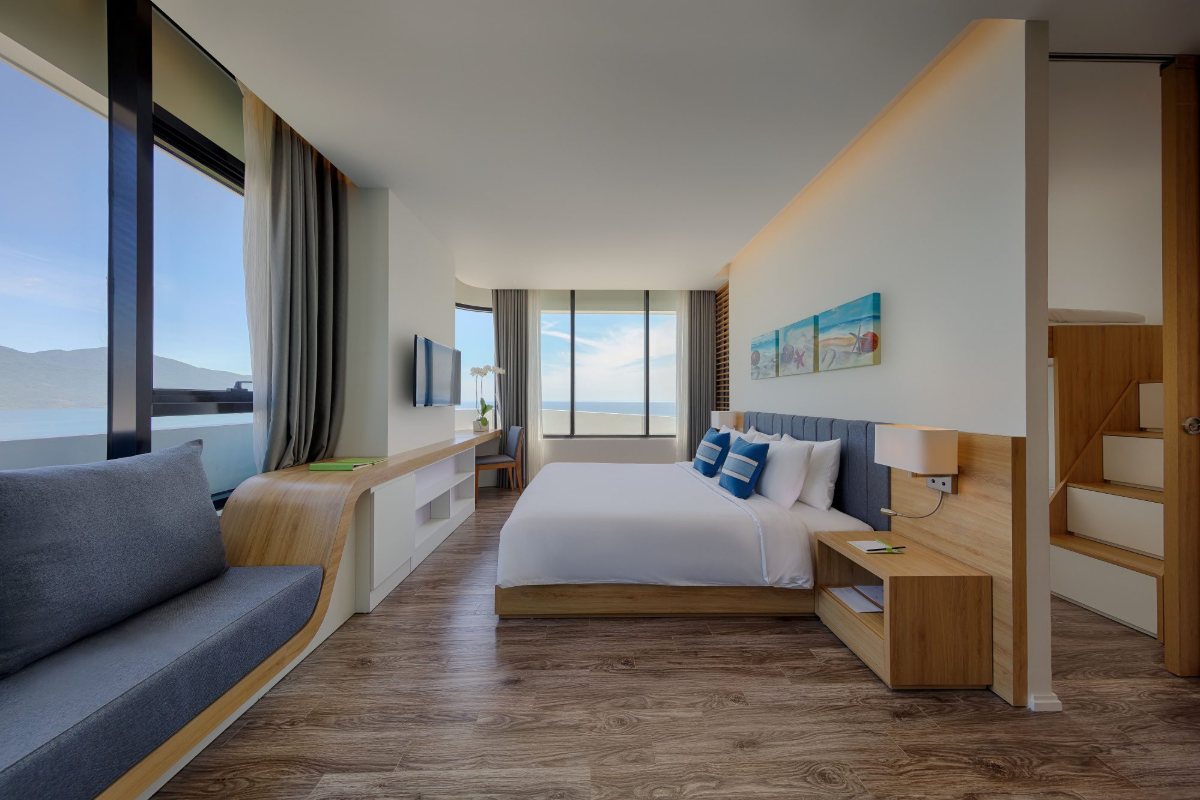 Guest room with sofa at Parosand Danang Hotel