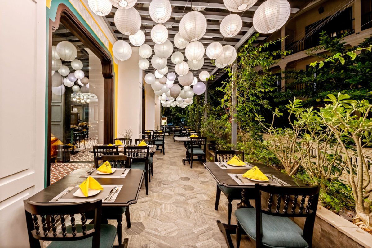 Garden dining area with lanterns at Son Hoi An Boutique Hotel
