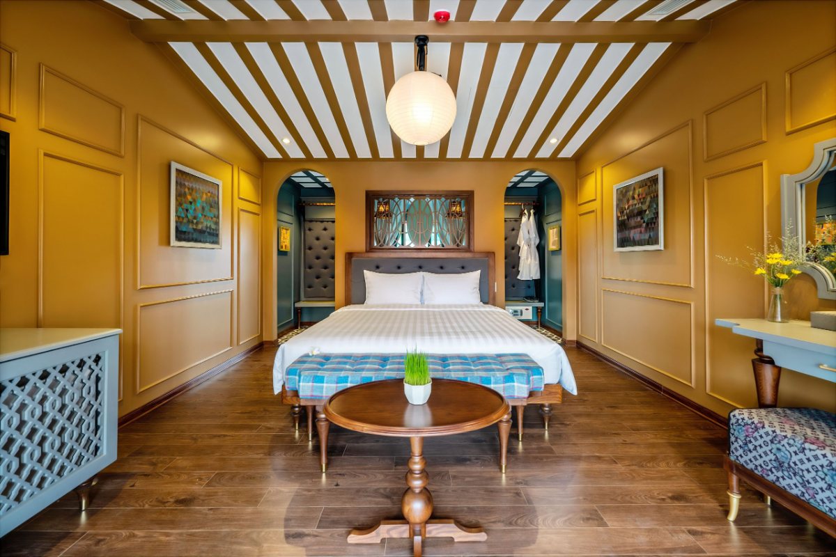 Guest room in yellow heritage style at Son Hoi An Boutique Hotel