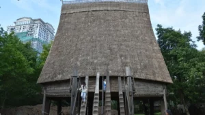Bahnar communal house with its tall thatched roof, Vietnam Museum of Ethnology, Hanoi