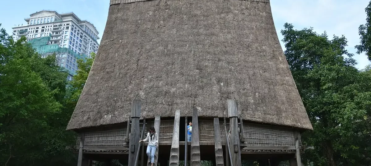 Bahnar communal house with its tall thatched roof, Vietnam Museum of Ethnology